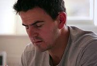 Man with eyes closed in prayer.