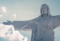 Statue of Christ With Hands Out To The Side