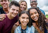 A group of friends smile together