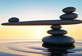 Rocks balancing on rippling water