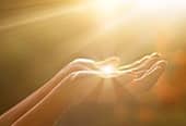 Hands holding light