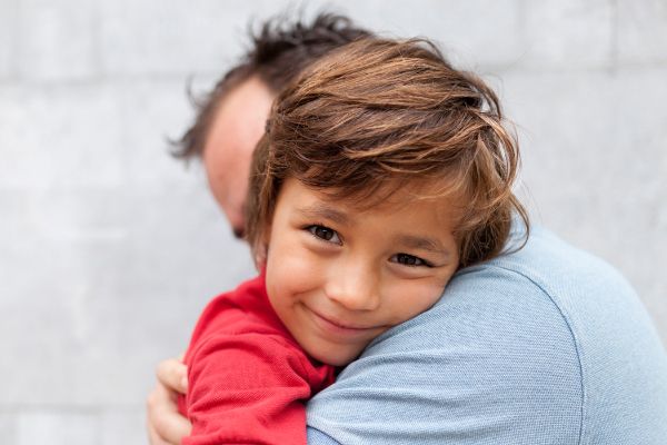 A father hugging his son
