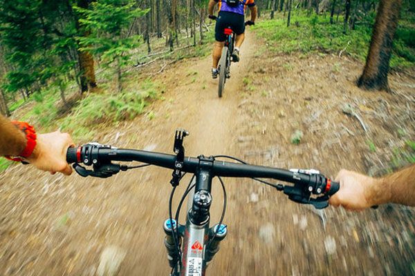 Person mountain biking